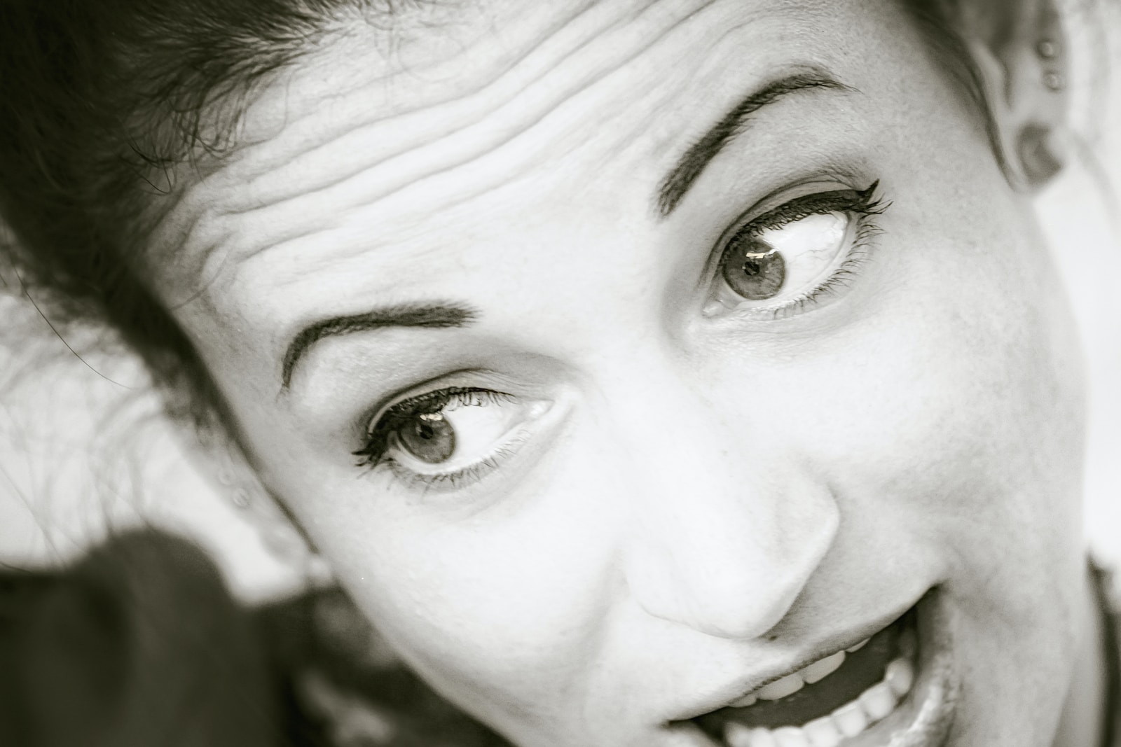 grayscale photo of womans face